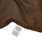 Close-up of a silk in Chaga with a label detailing care instructions